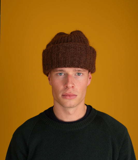 Model wearing the chocolate brown Orlu Beanie with a black sweater