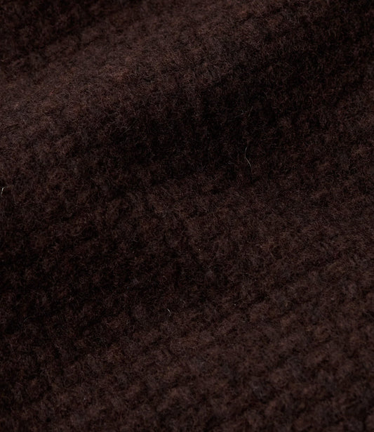 Close-up of the mahogany Panama weave lambswool of the Valur vest