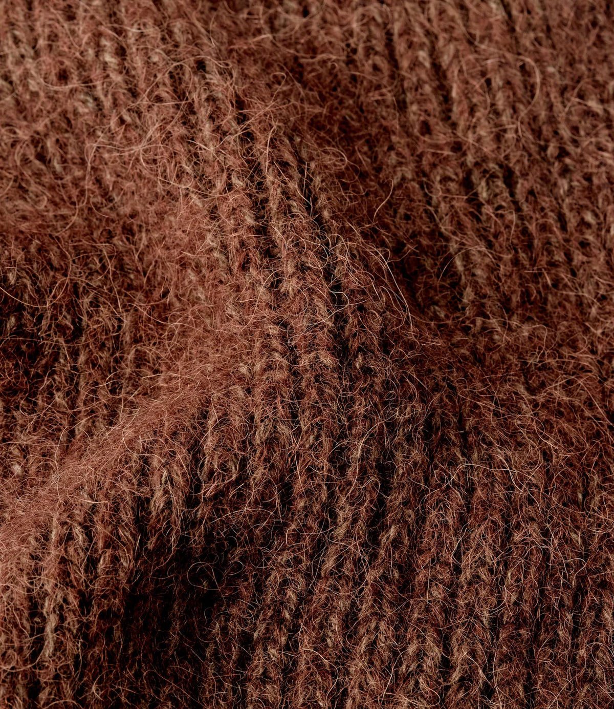 Close-up of the hairy chocolate brown alpaca knit