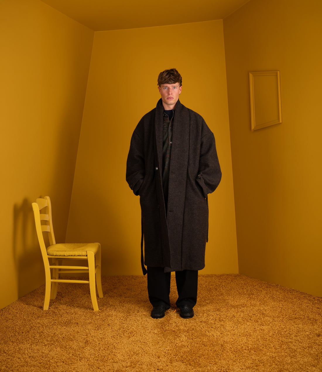 Model wearing the Jaca Coat open with a black scarf