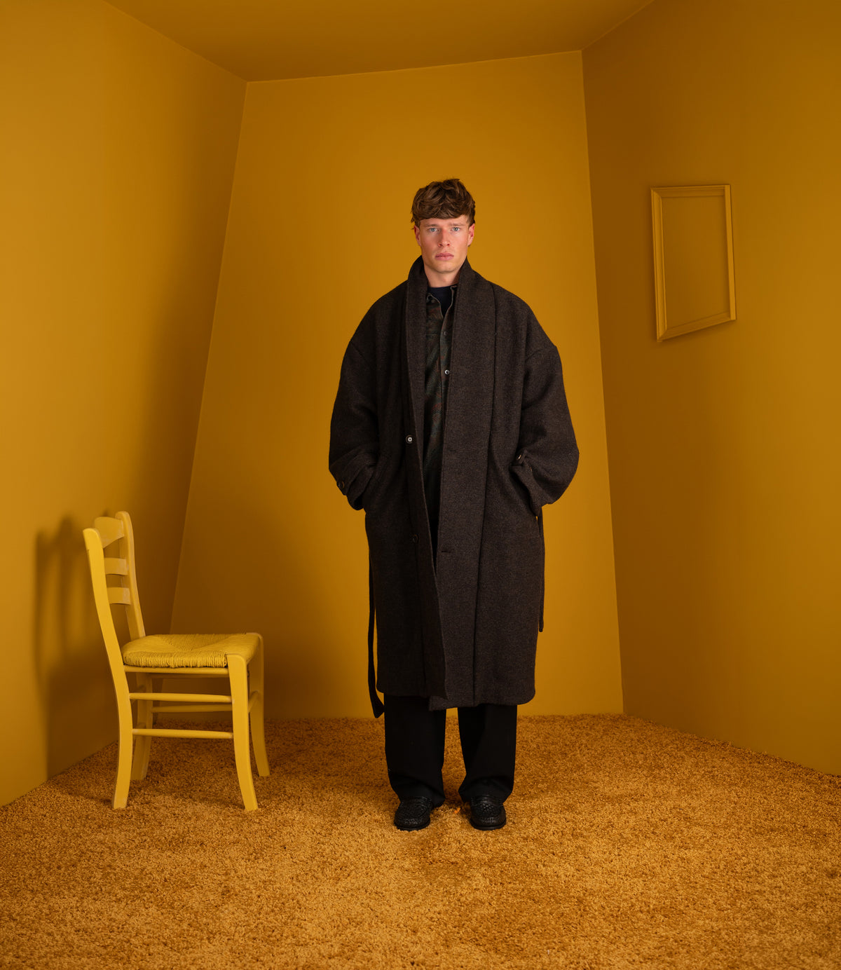 Model wearing the Jaca Coat open with a black scarf