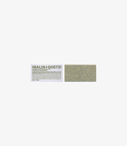 Malin + Goetz mandelic exfoliating bar with eucalyptus next to its box